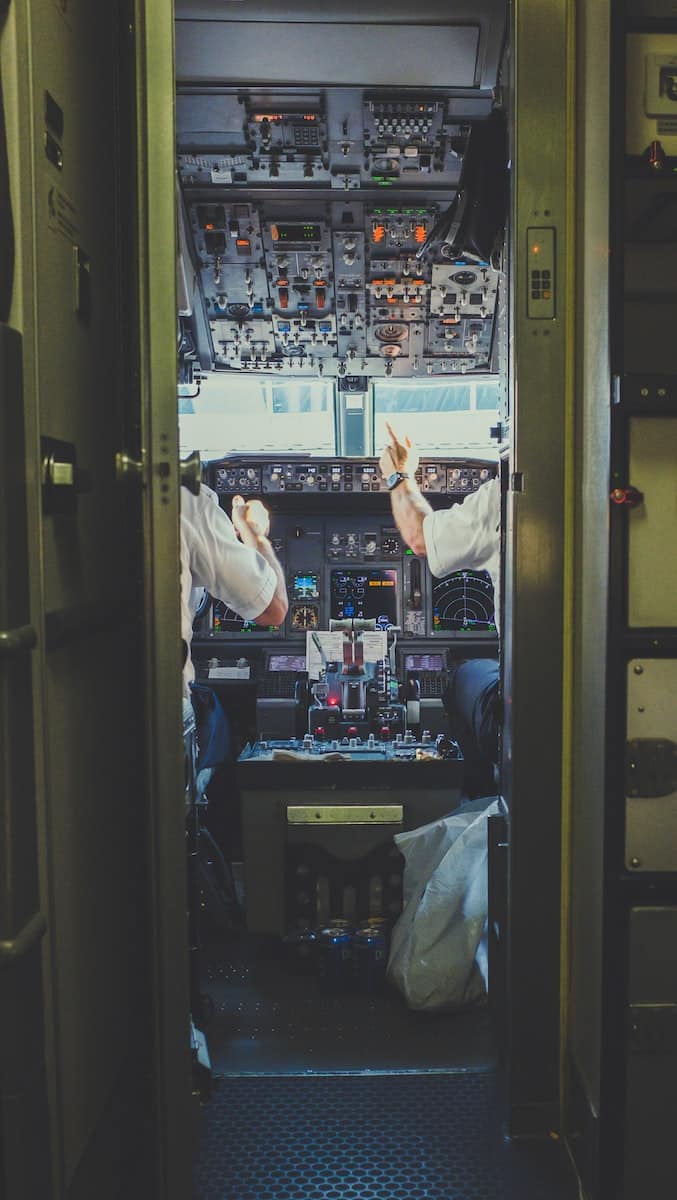 pilot and copilot inside plane cockpit